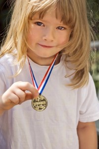 child with gold medal (428x640)