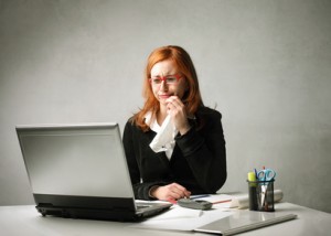 woman at desk crying